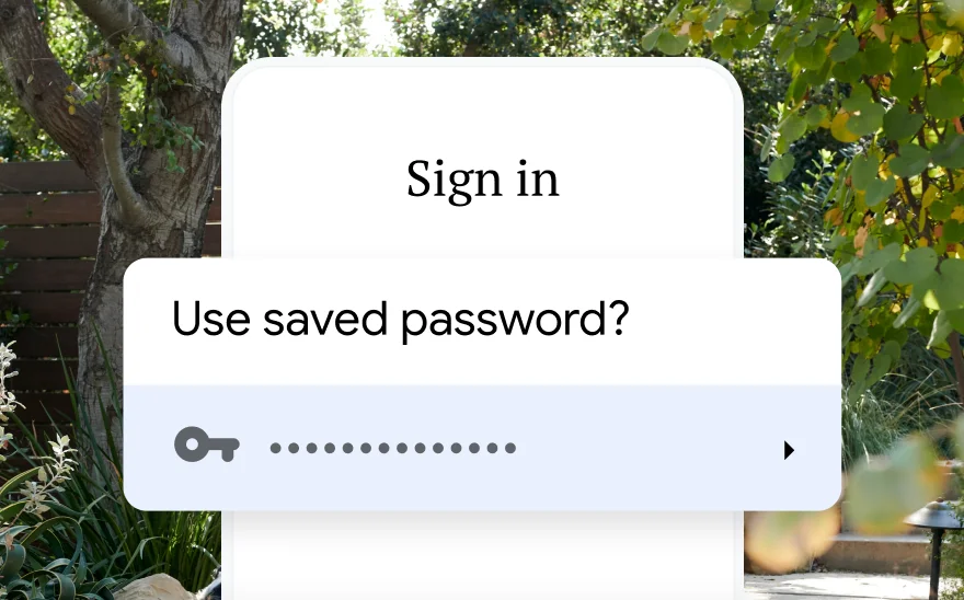 A sign in page for a trip reservation asks to use a saved password. In the background is a nature scene.